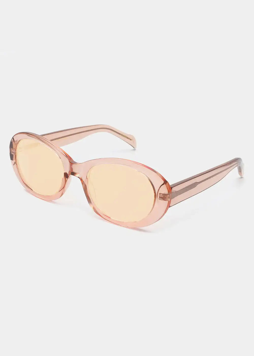 Oval champagne tinted sunglasses with transparent frame on white background