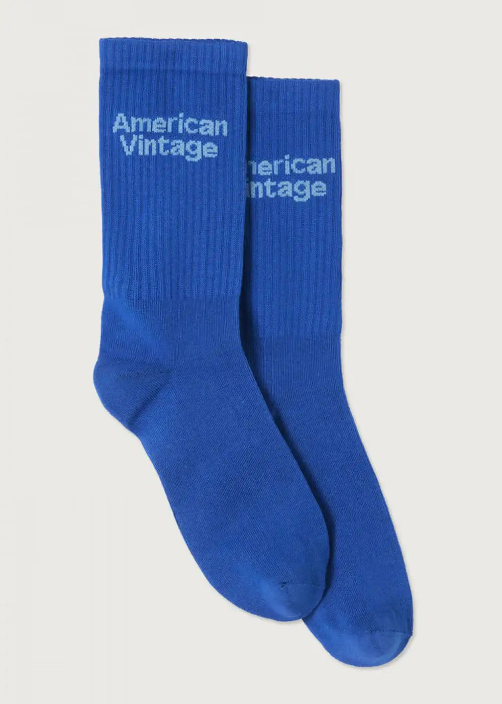 Pair of blue ribbed socks with 'American Vintage' text, laid flat on white background