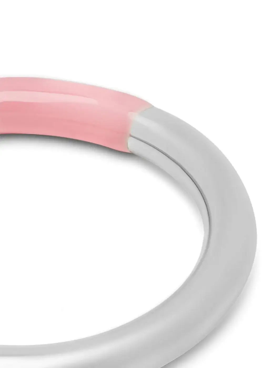 Close-up of a silver and light pink double color ring on a white background