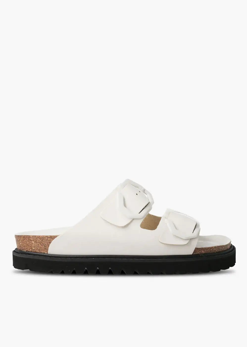 White double-strap sandal with large buckles, cork footbed and black ridged sole