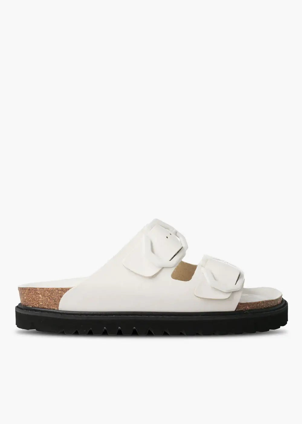 White double-strap sandal with large buckles, cork footbed and black ridged sole