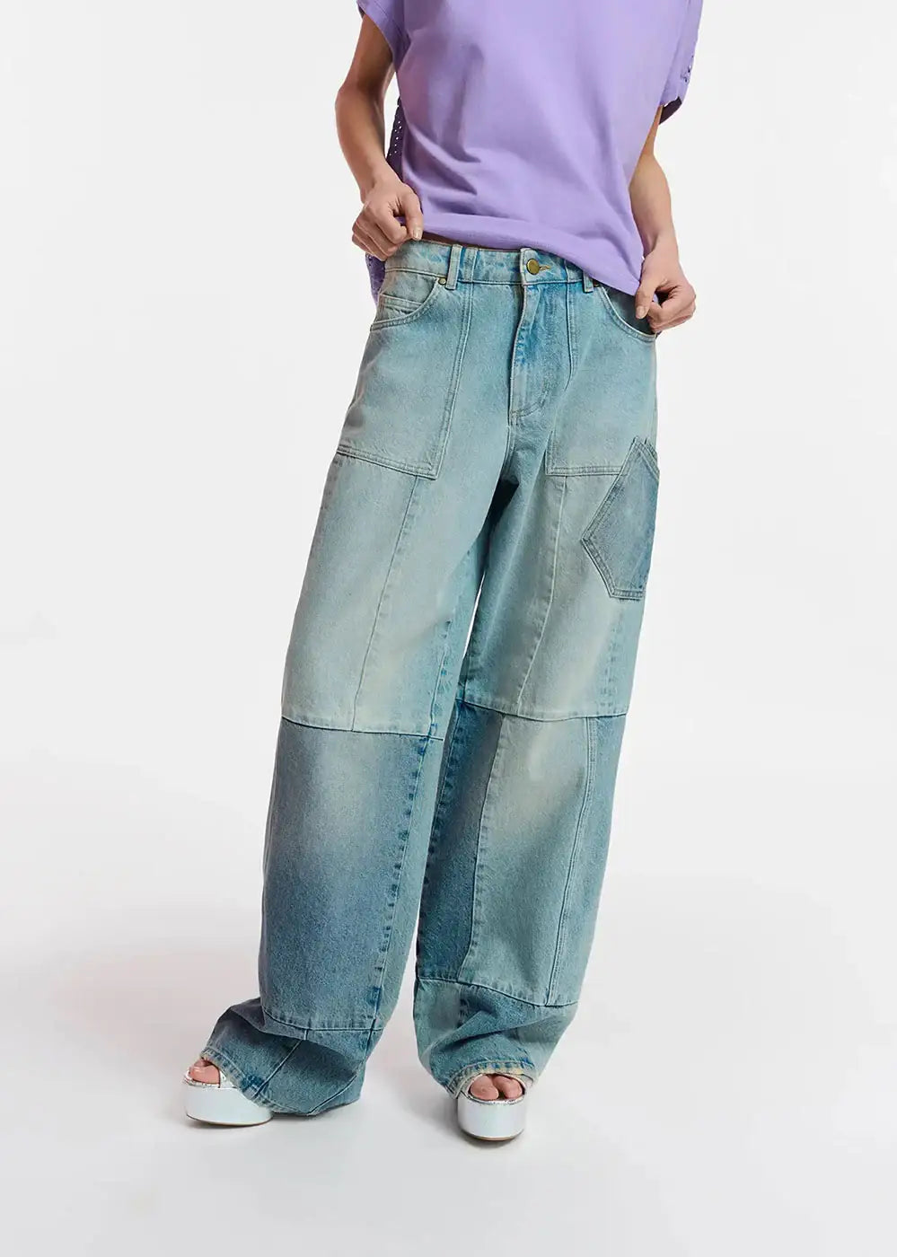 Wide leg patchwork jeans with faded wash, styled with lilac t-shirt and platform sandals