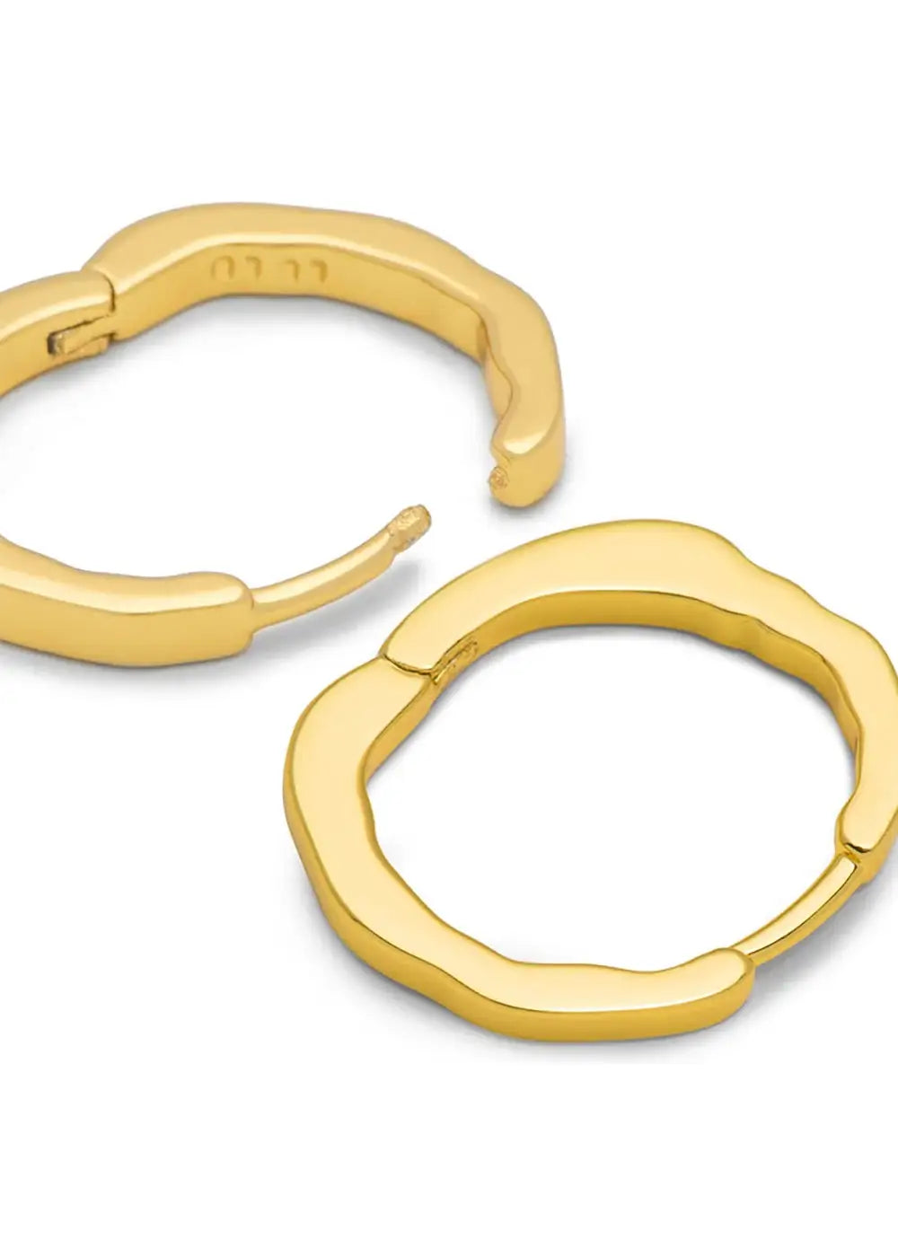 Pair of organic-shaped gold plated hoop earrings on white background