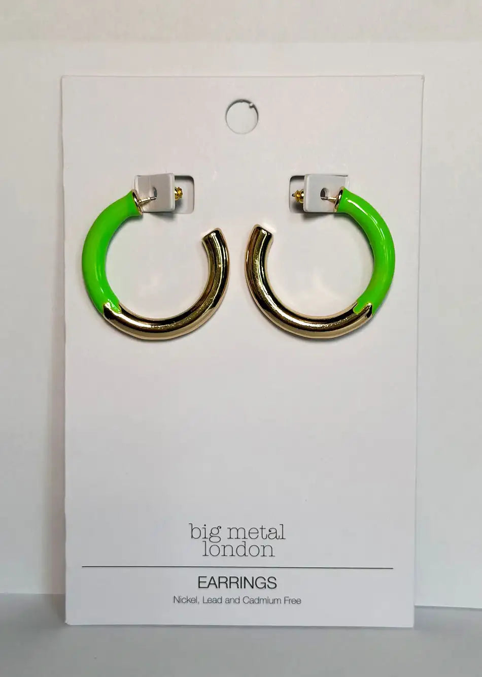 Gold and neon green hoop earrings on display card, modern fashion jewelry