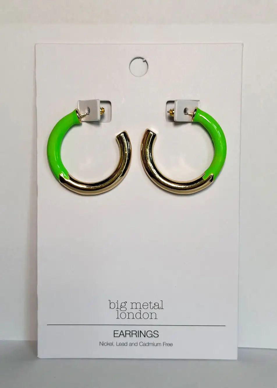 Gold and neon green hoop earrings on display card, modern fashion jewelry