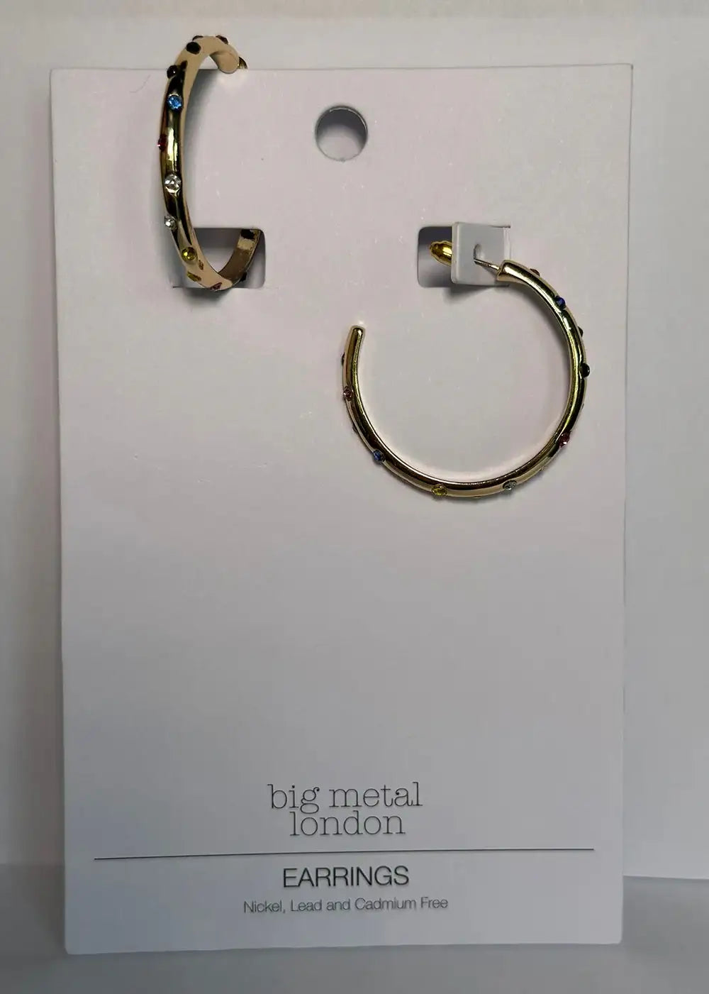 Gold hoop earrings with multicolored gemstones on display card, stylish statement jewelry