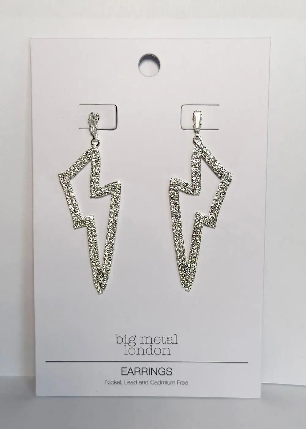 Silver glitter lightning bolt drop earrings on display card