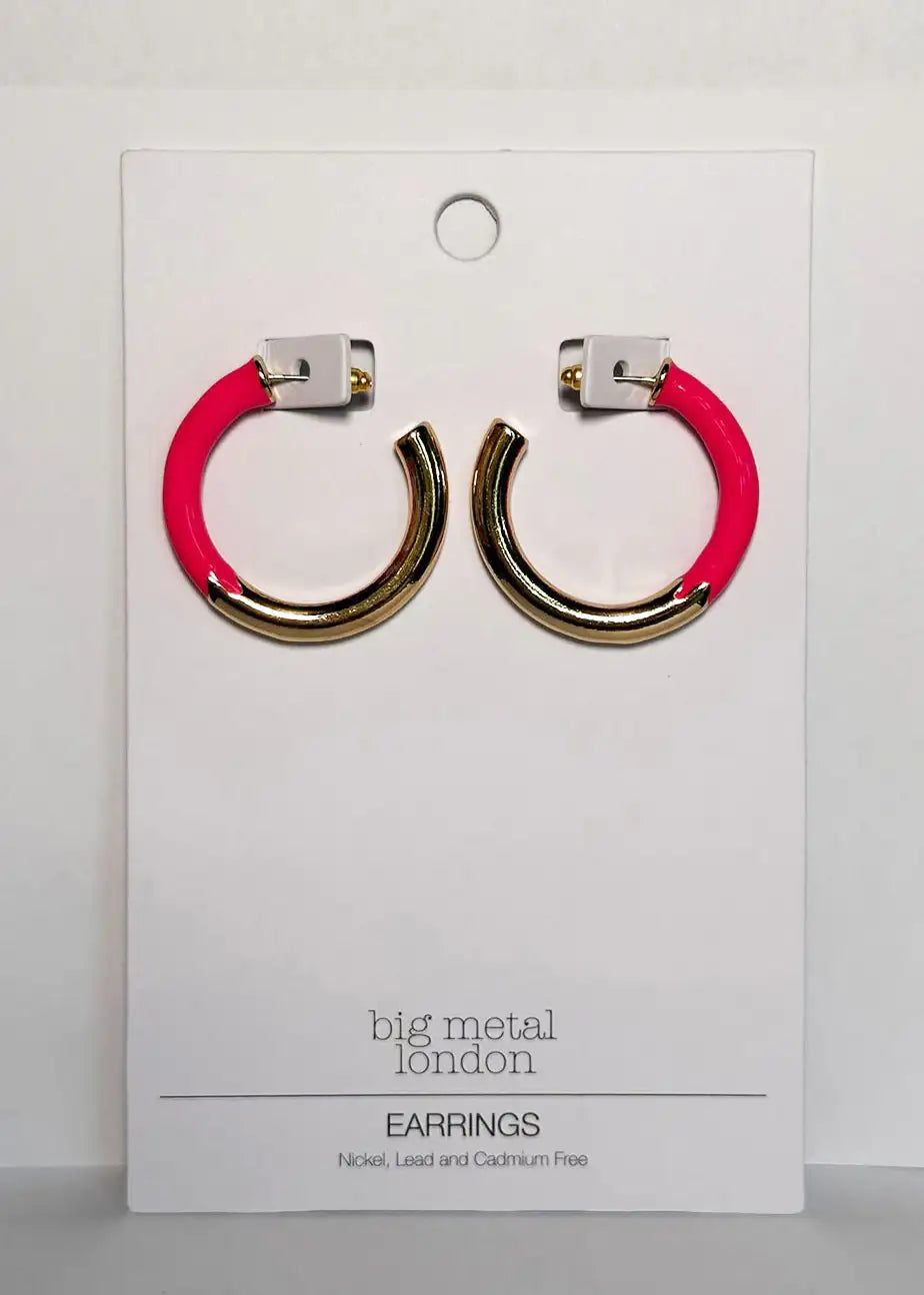 Gold and pink hoop earrings on a display card, modern fashion jewelry.