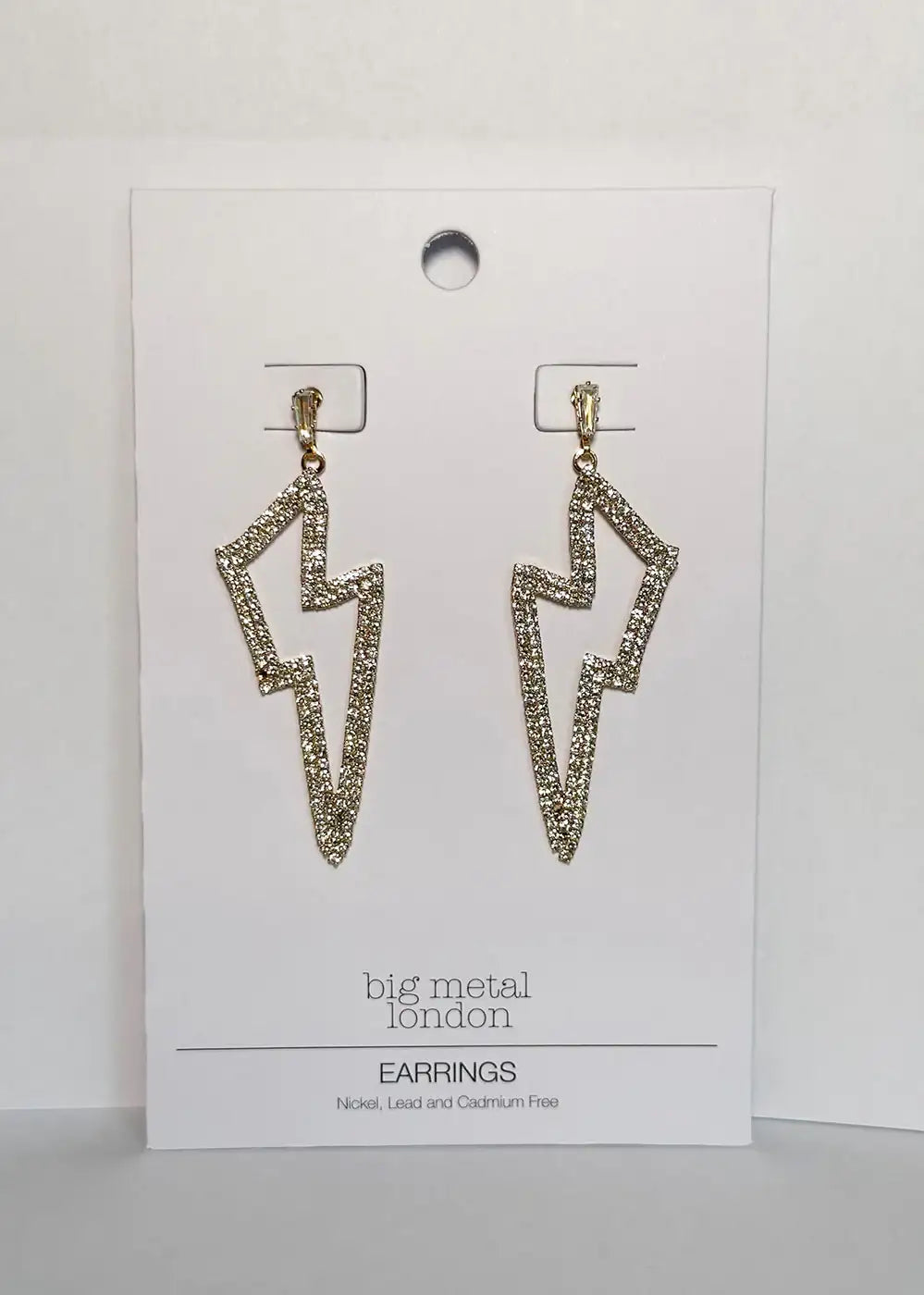Gold glitter lightning bolt drop earrings on display card
