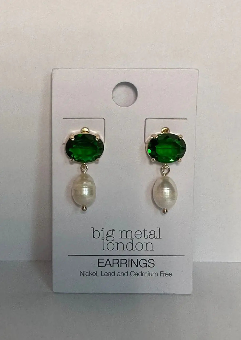 Green crystal and pearl drop earrings on display card, elegant fashion jewelry