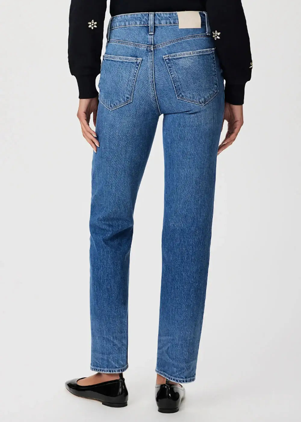 Back view of straight leg blue jeans with high waist on model