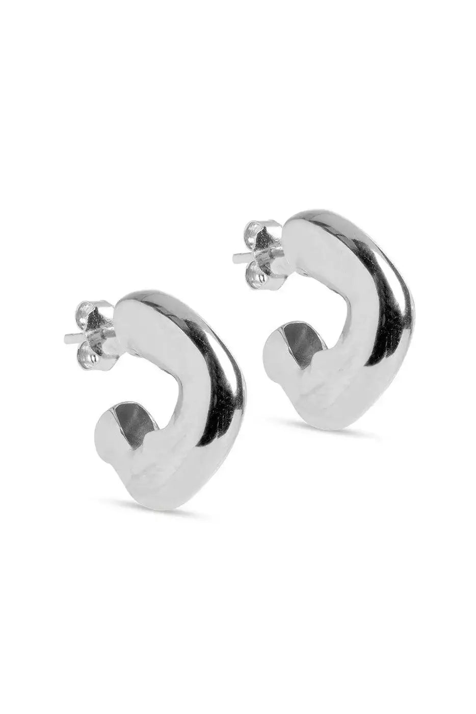 Chunky silver hoop earrings with a modern, sculptural design on a white background