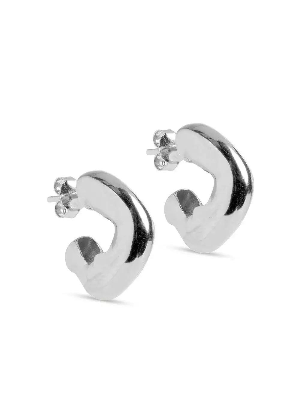 Chunky silver hoop earrings with a modern, sculptural design on a white background