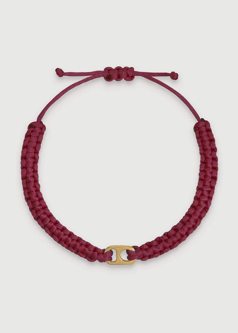 Burgundy braided adjustable bracelet with a gold-tone central accent on white background