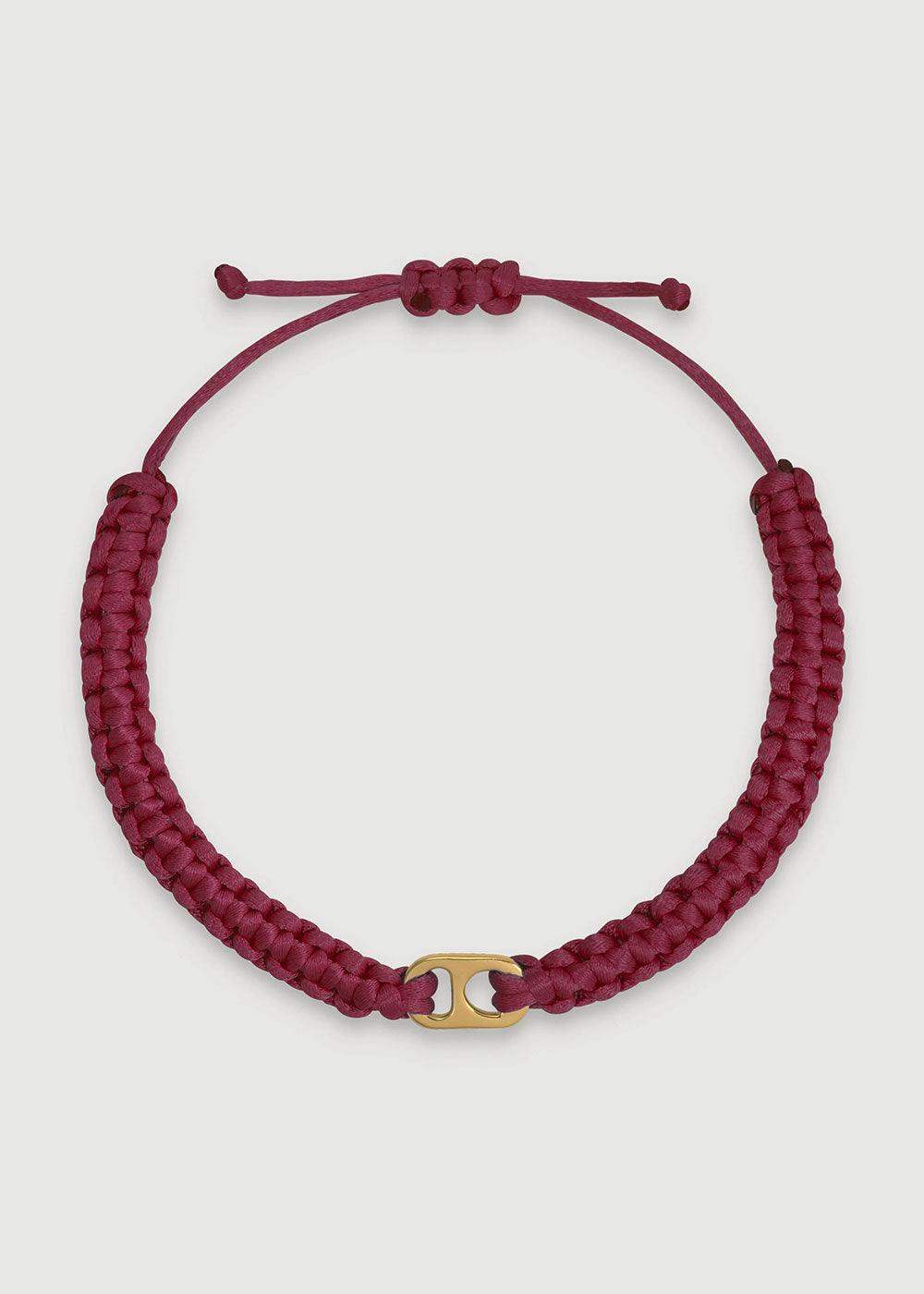 Burgundy braided adjustable bracelet with a gold-tone central accent on white background