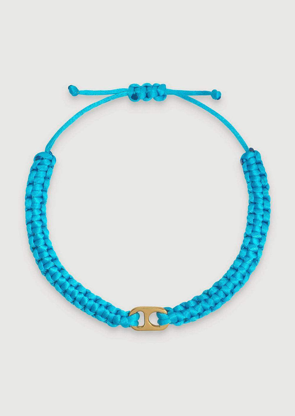 Blue braided adjustable bracelet with gold-tone central charm on white background