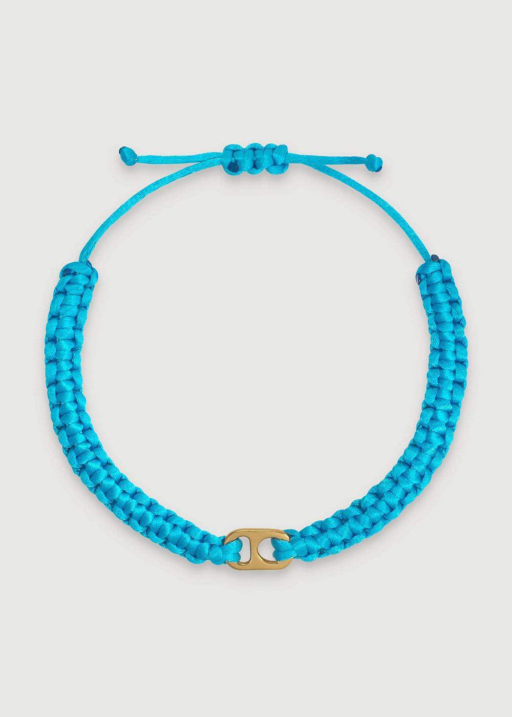 Blue braided adjustable bracelet with gold-tone central charm on white background
