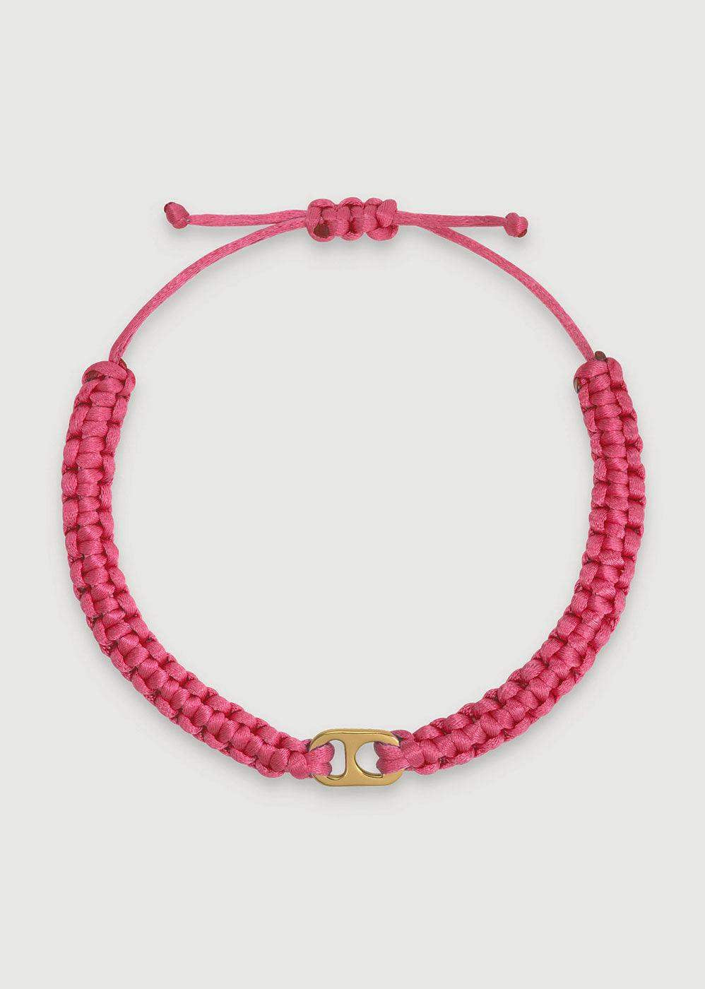 Pink braided adjustable bracelet with gold connector on white background