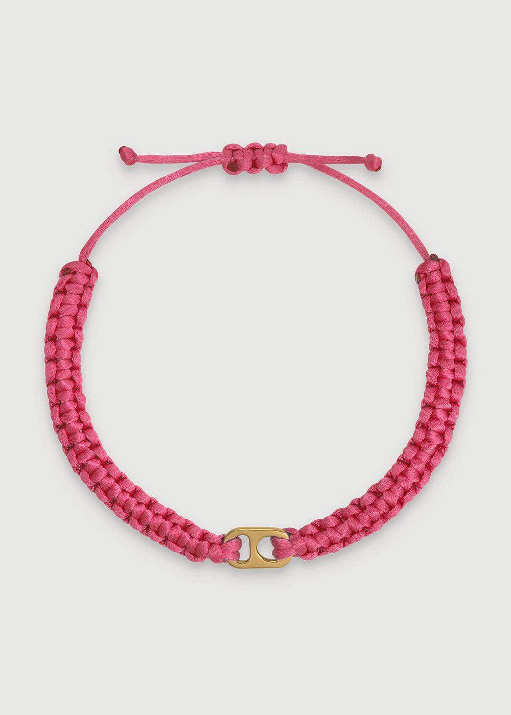 Pink braided adjustable bracelet with gold connector on white background