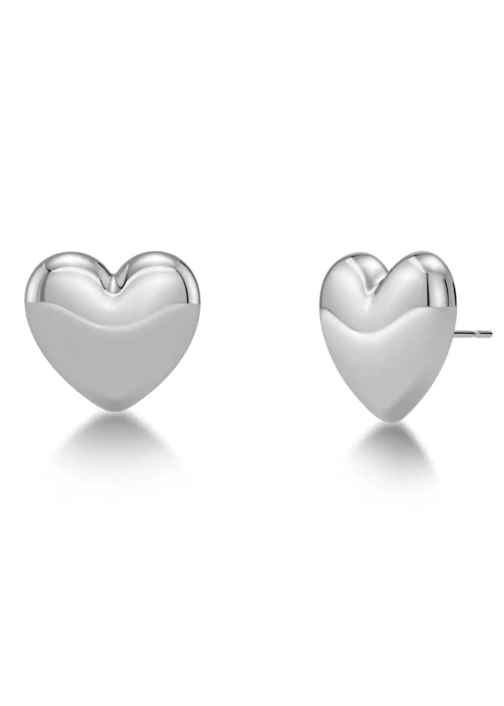 Pair of polished silver heart stud earrings on white background