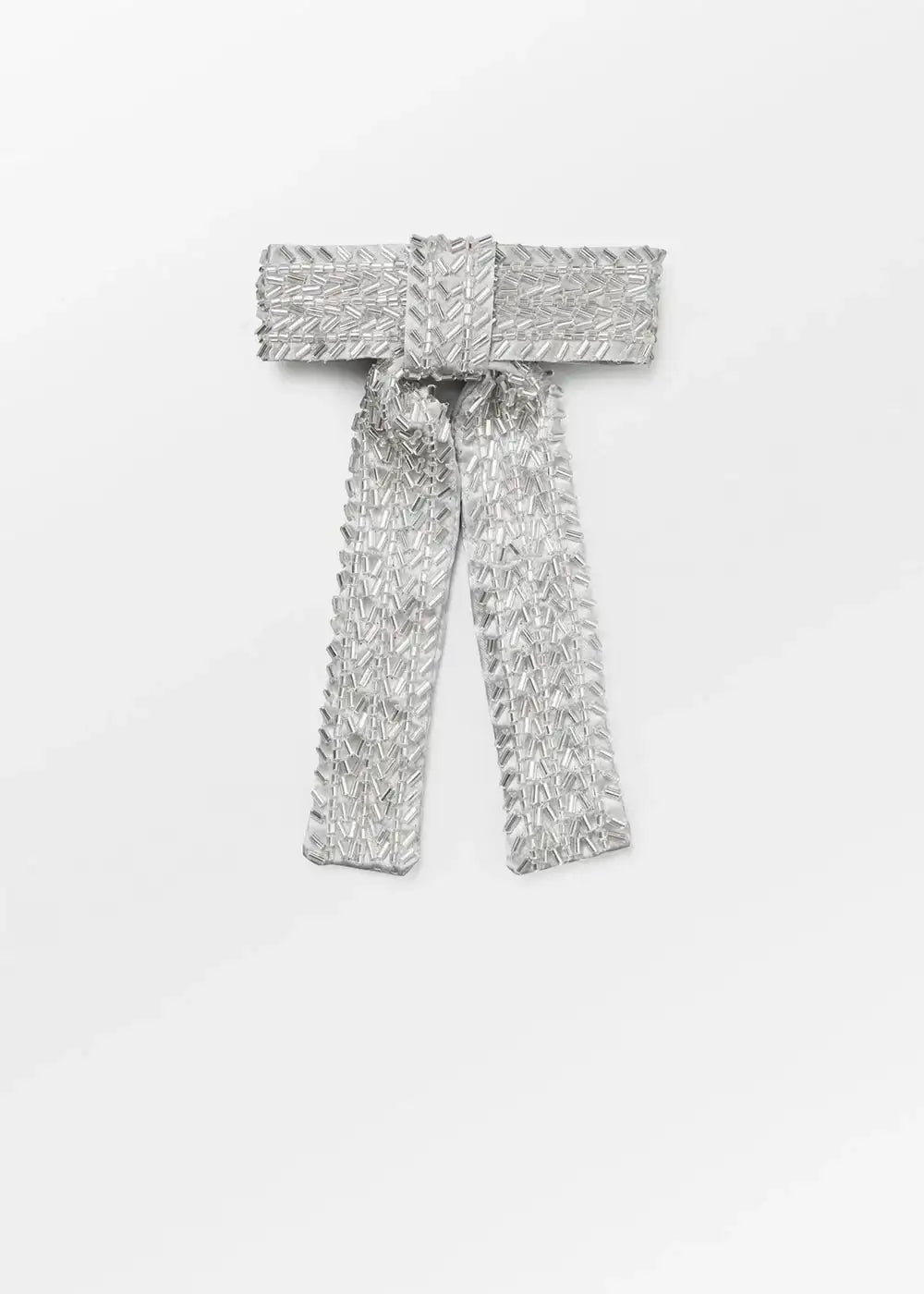 Silver sequin embellished bow brooch with beaded detail on white background
