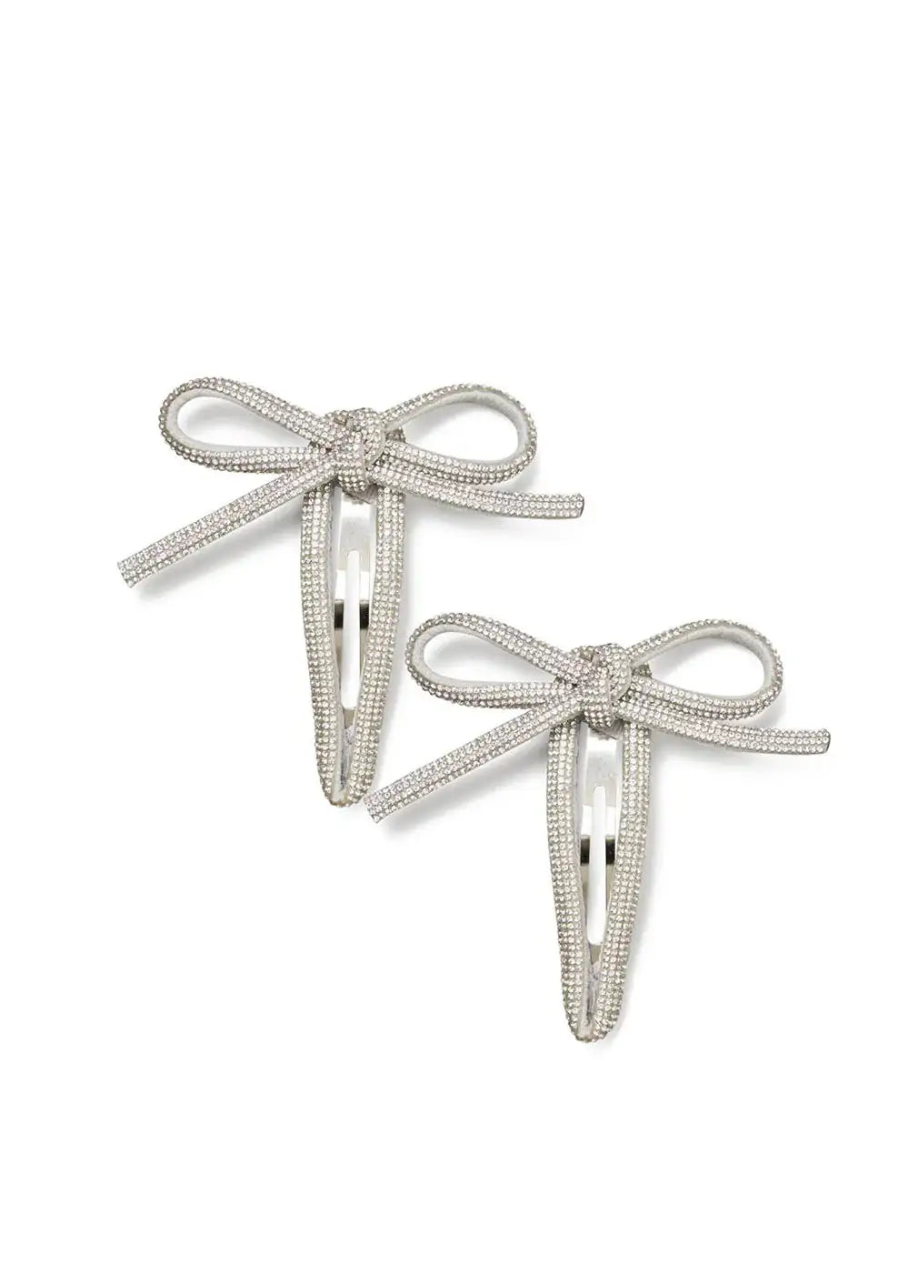 Pair of silver rhinestone bow hair clips on white background
