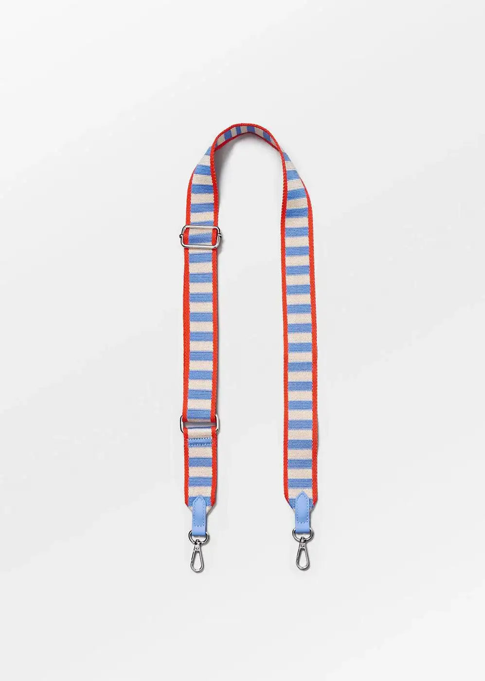 Striped blue and white adjustable bag strap with red edges and metal clasps on white background