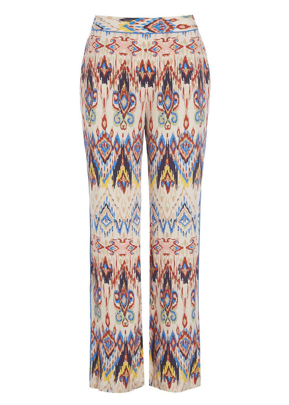 Wide leg trousers with a multicolour geometric print pattern on a light background