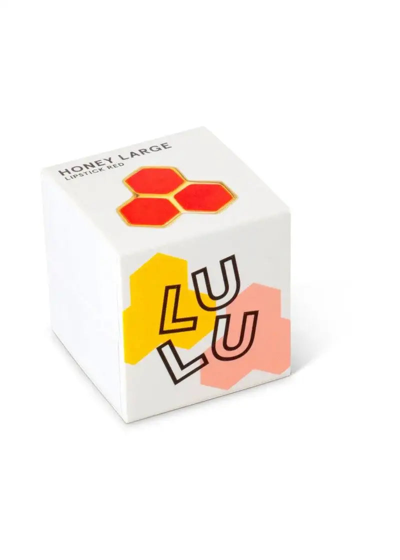 White product box with honeycomb and red hexagon design, labeled Honey Large Lipstick Red.