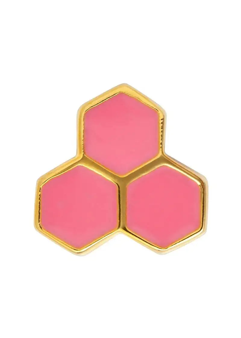 Gold and pink hexagon stud earring with modern geometric design, close-up on white background