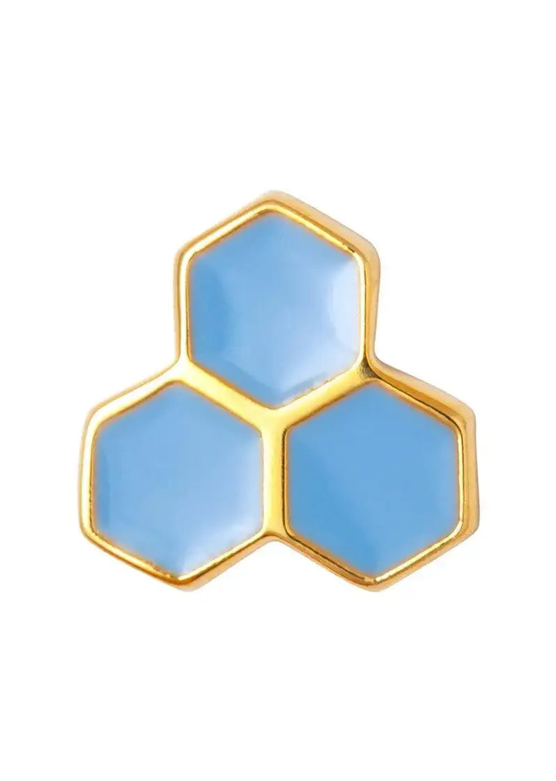 Gold and blue hexagonal stud earring with honeycomb design on white background