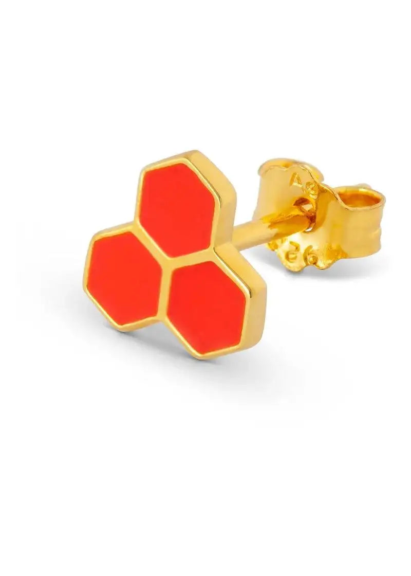 Gold stud earring with three red hexagonal shapes, modern geometric jewelry