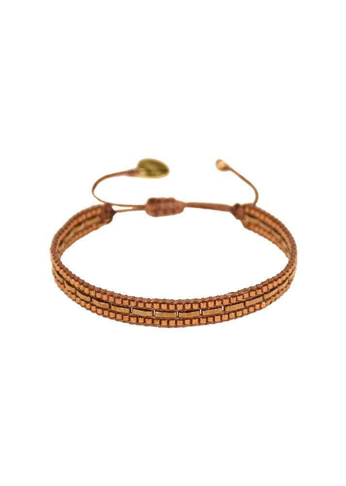 Brown and gold beaded adjustable bracelet with a domino-style pattern on white background