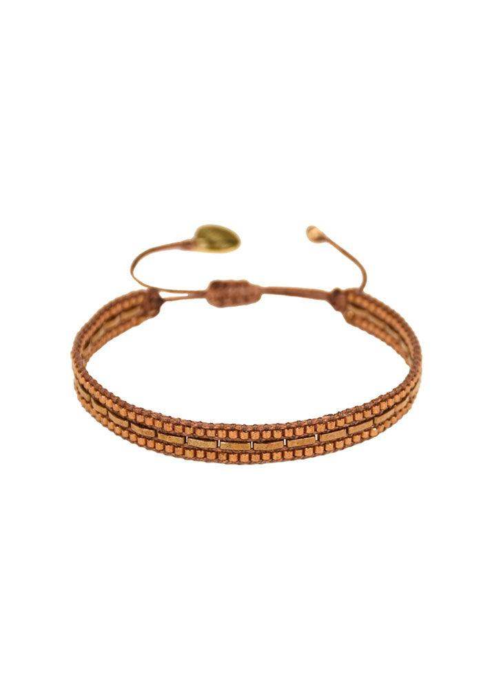 Brown and gold beaded adjustable bracelet with a domino-style pattern on white background