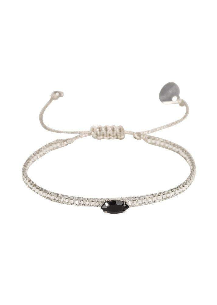 Adjustable silver diamond eye bracelet with black oval stone centerpiece on white background