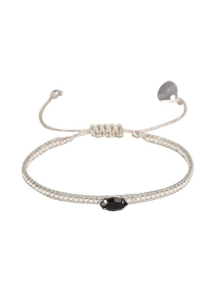 Adjustable silver diamond eye bracelet with black oval stone centerpiece on white background