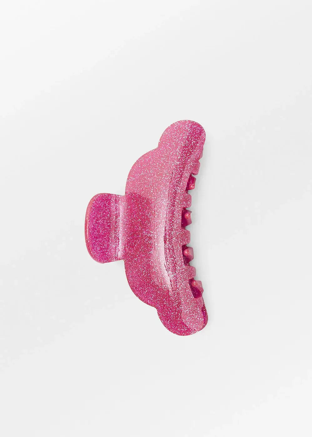Pink glittery hair claw clip on white background