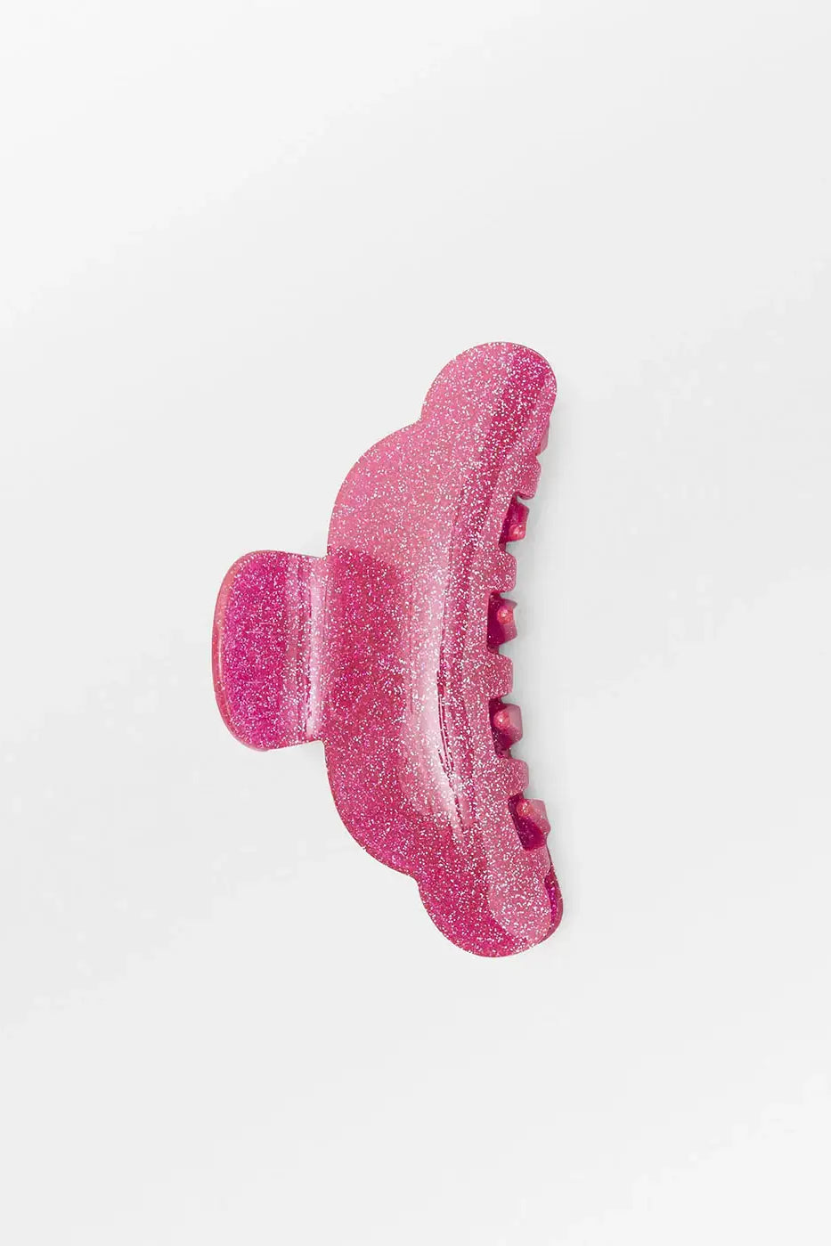 Pink glittery hair claw clip on white background