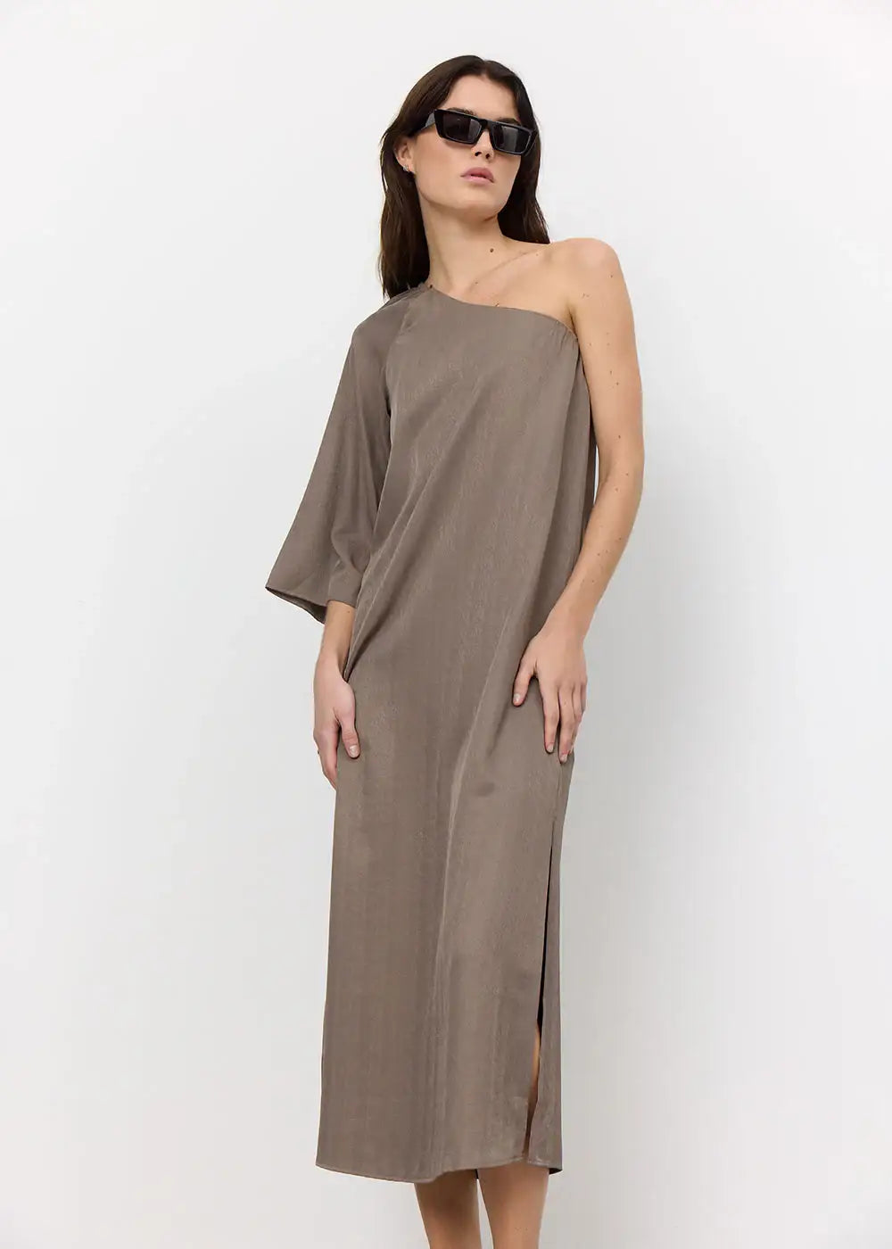 Woman in taupe one-shoulder midi dress with sunglasses, minimalist fashion style