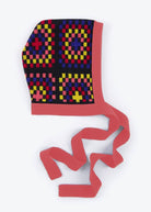 Colorful patterned headscarf with a red border on a white background