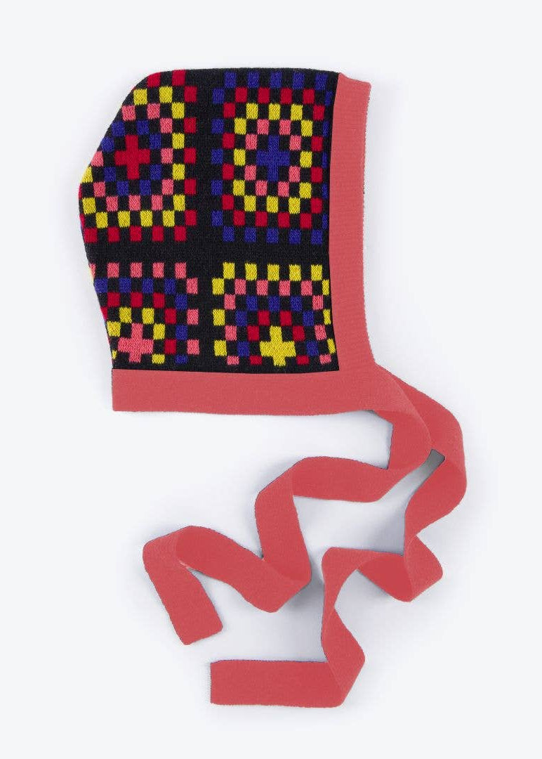 Colorful patterned headscarf with a red border on a white background