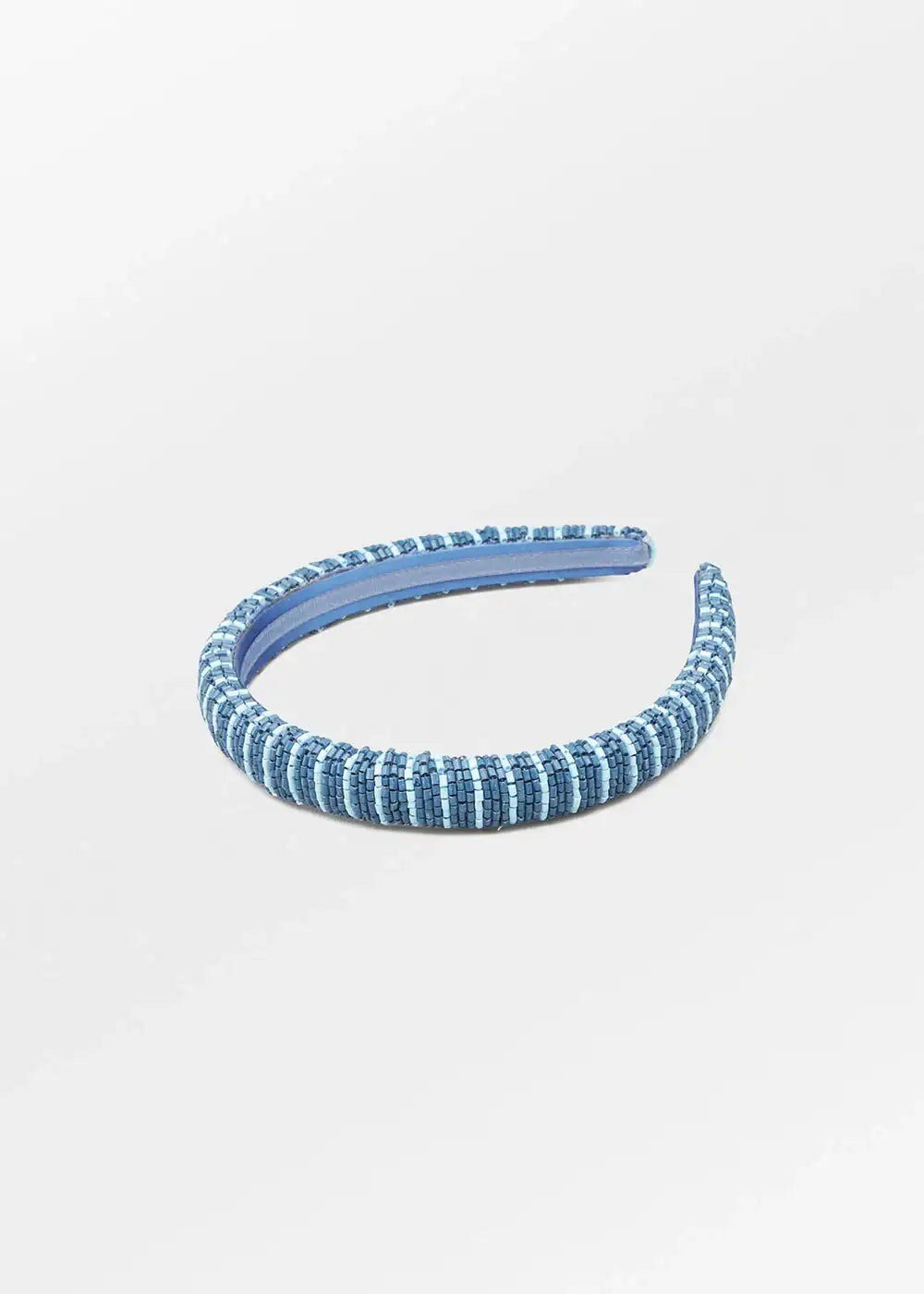 Blue beaded headband on a white background, stylish hair accessory for women